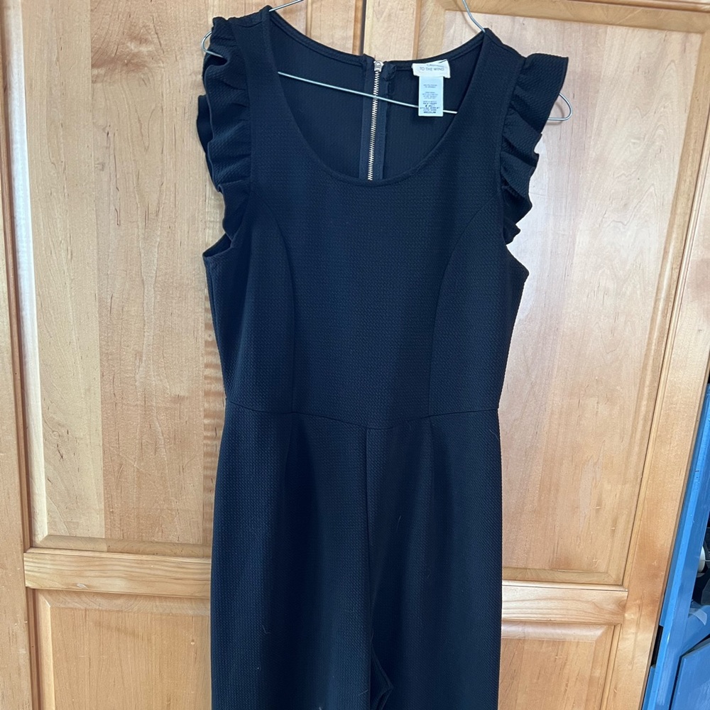 Black jumpsuit that is stylish and flattering. Size Medium